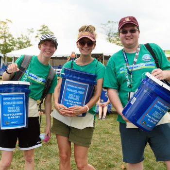 Bucket Brigade volunteers pose for a photo during the 2022 National Folk Festival in Downtown Salisbury. Photo Credit: SMDi Photography