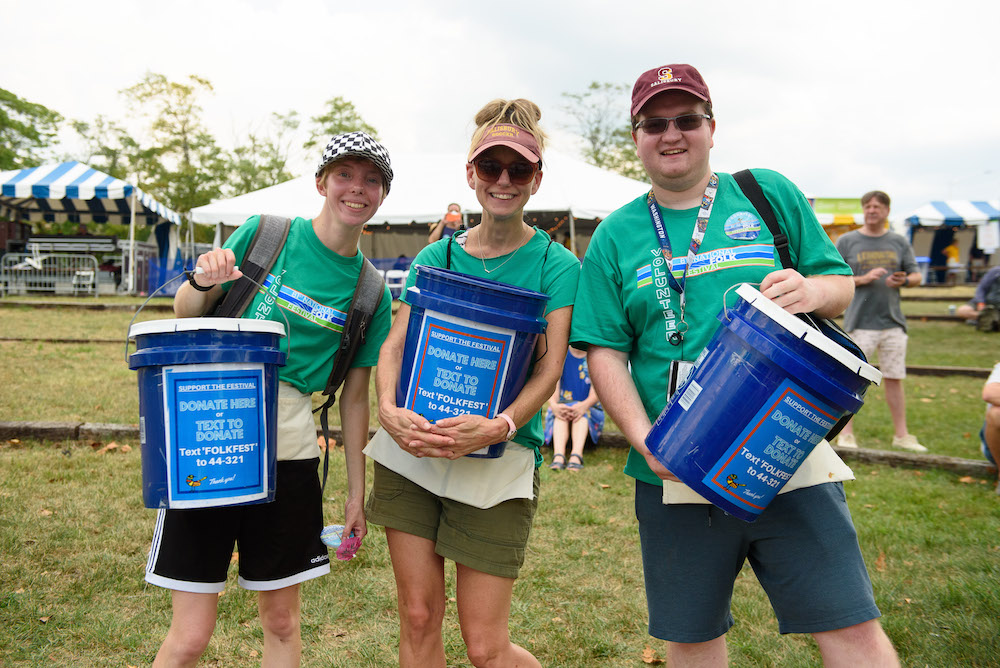 Bucket Brigade volunteers pose for a photo during the 2022 National Folk Festival in Downtown Salisbury. Photo Credit: SMDi Photography